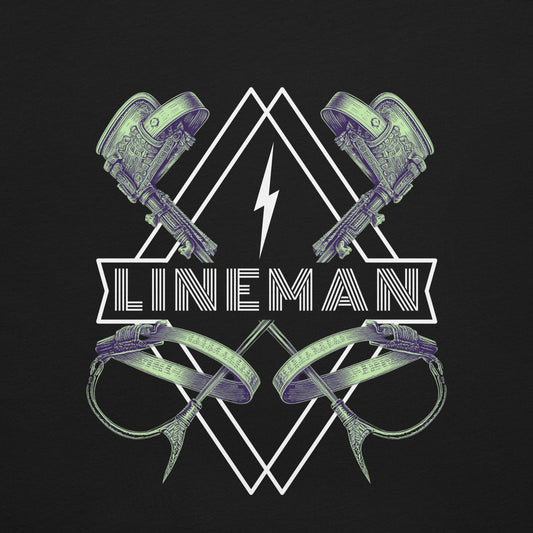 Close up black lineman shirt with graphic of climbers and gaffs, lightning bolt, and bold lineman text.