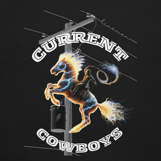 close up black lineman shirt with electric lineman on horse and 'Current Cowboys' text over a power pole and 'lineman' written on the line.