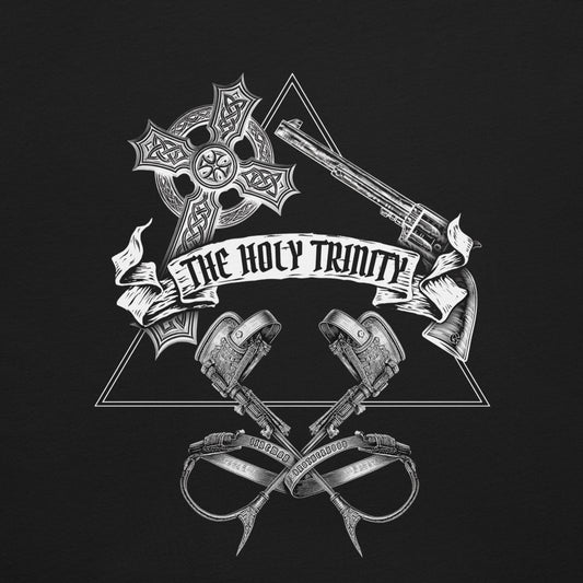 Close up black lineman t-shirt with white graphic design featuring 'The Holy Trinity' text and symbols of a cross, gun, and lineman gaffs in triangle.