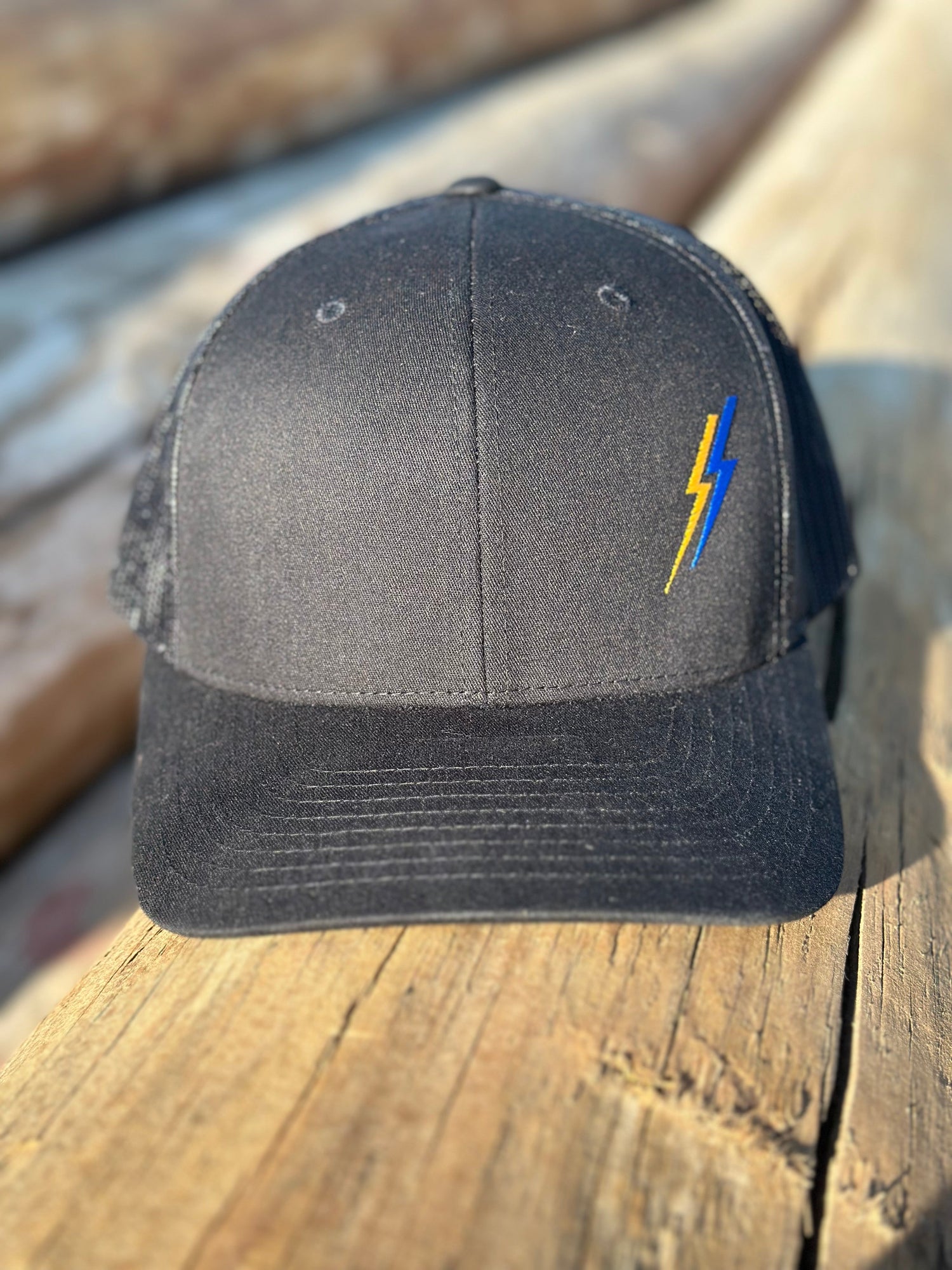Black electrician hat and lineman hat with ARC Apparel logo on side