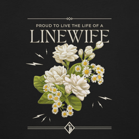 Close up black linewife shirt. Flower and lightning image with text that reads proud to live the life of a linewife. 