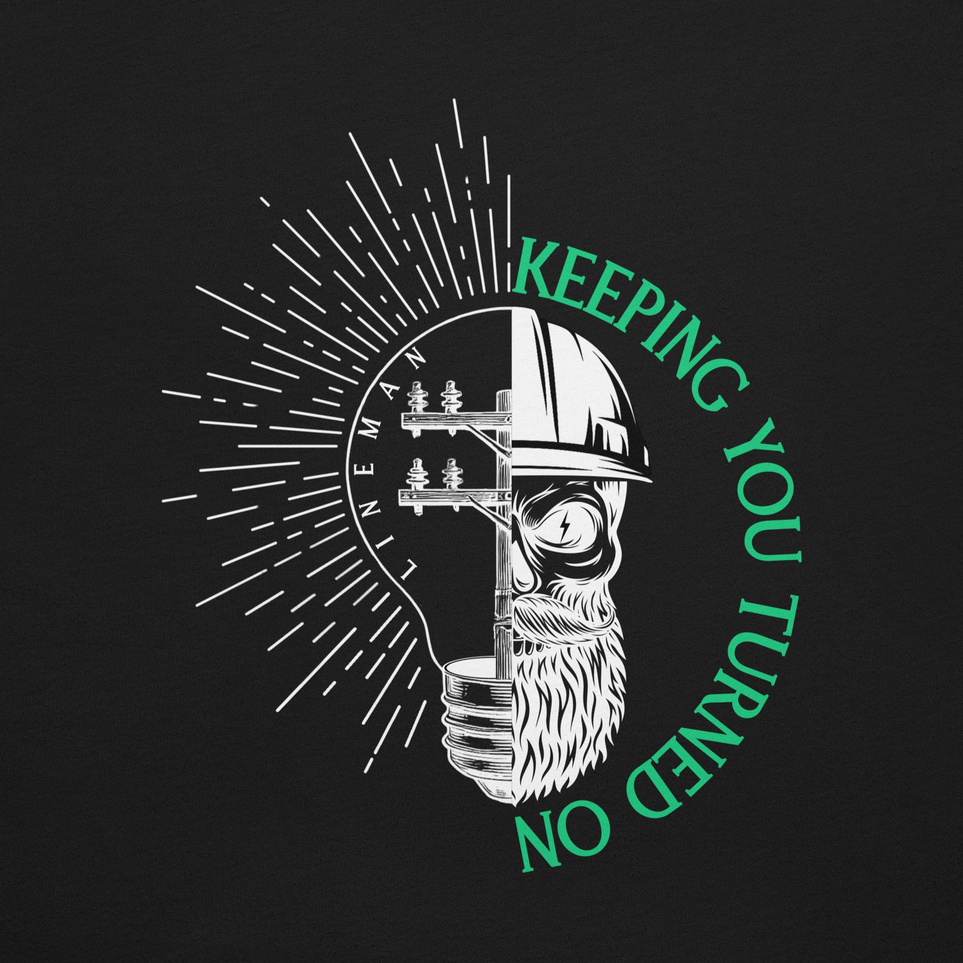Close up Black lineman shirt with lightbulb, power pole, and skeleton in hard hat. Text that reads lineman and keeping you turned on.