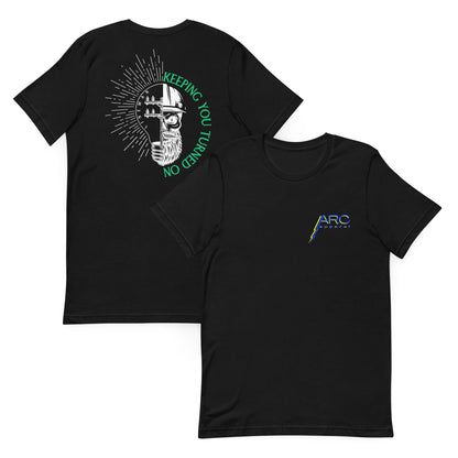 Black lineman shirt with lightbulb, power pole, and skeleton in hard hat. Text that reads lineman and keeping you turned on. ARC Apparel logo on front.