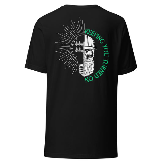 Black lineman shirt with lightbulb, power pole, and skeleton in hard hat. Text that reads lineman and keeping you turned on.