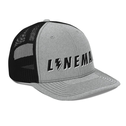 side of lineman hat with embroidered text and lightning bolt symbol replacing the letter i. grey front black back 